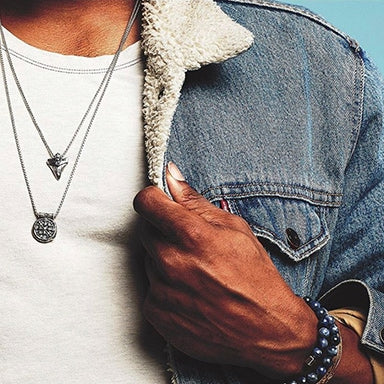 Man wearing ALEX AND ANI bracelets and necklaces