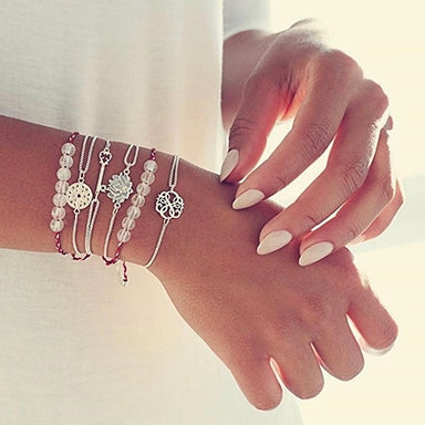 Woman wearing several precious bracelets