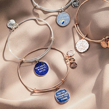 Four ALEX AND ANI bracelets with messages
