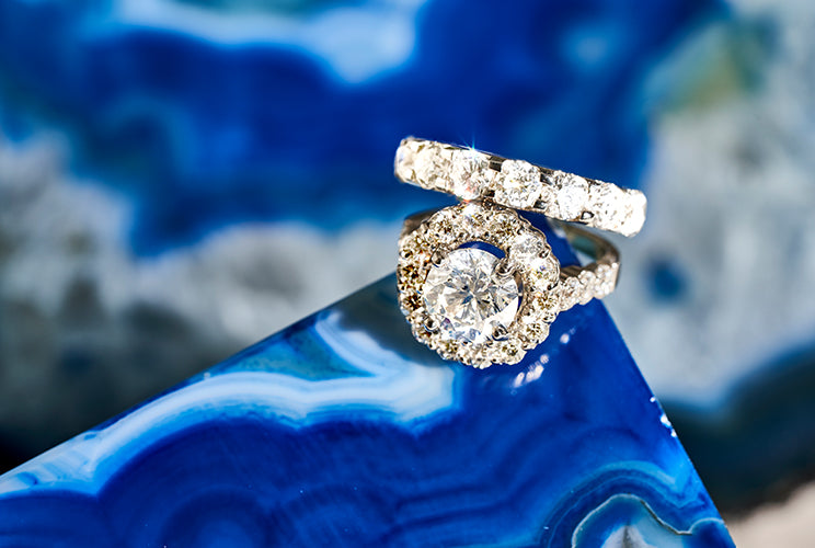 Diamond rings sitting on a blue rock