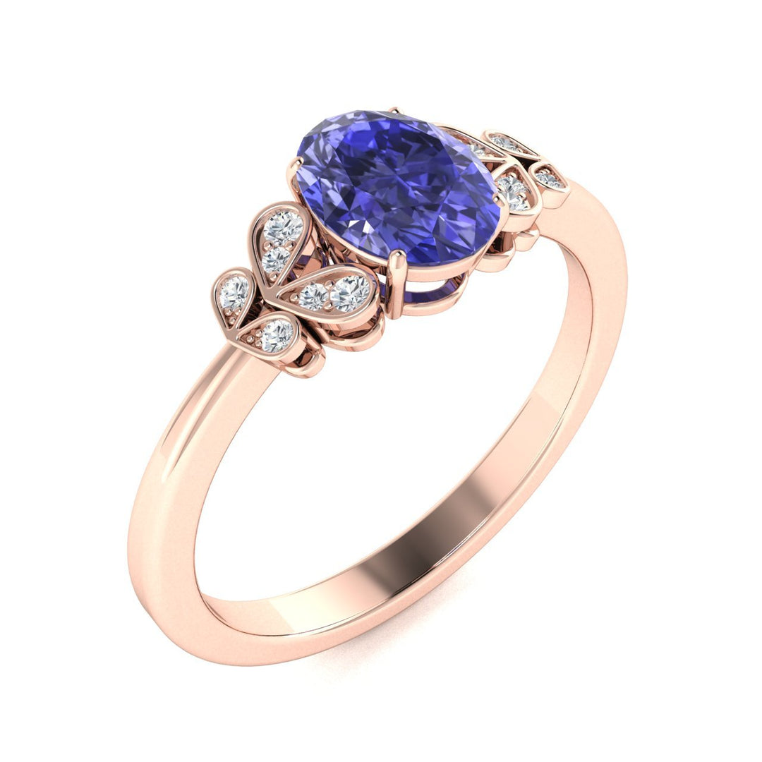 14KT Gold Oval Cut Tanzanite and Diamond Ring (Tanzanite 0.95 cts White Diamonds 0.04 cts)