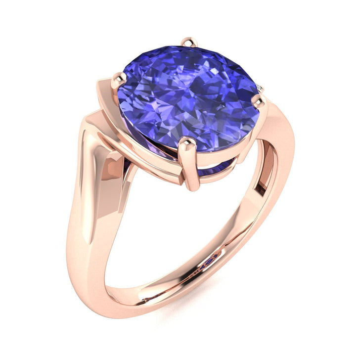 14KT Gold Oval Tanzanite and Diamond Ladies Ring (Tanzanite 3.25 cts. White Diamond 0.05 cts.)